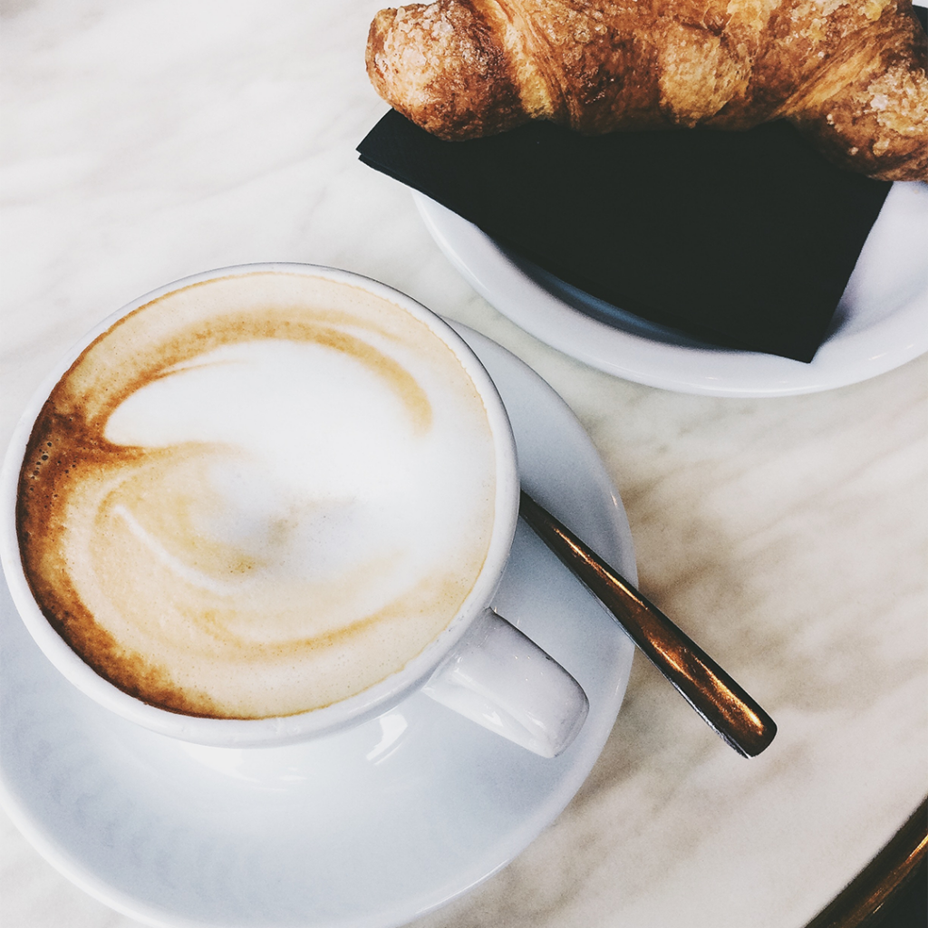 a cup of cappuccino using Italian branded kimbo coffee