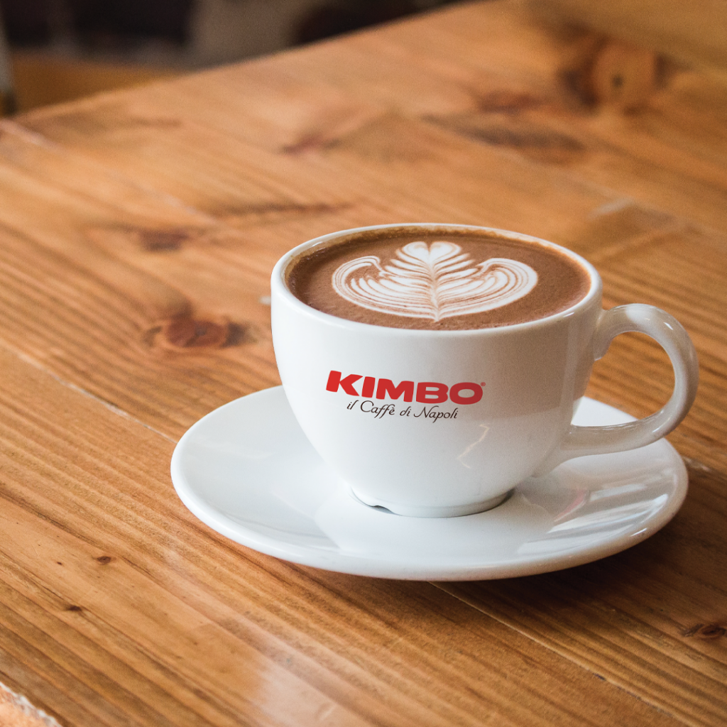 A cup of Italian Kimbo branded coffee